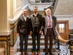 Left to right, Councillors Scott Cunliffe, Afrasiab Anwar and Howard Baker, in front of the stairs inside Burnley Town Hall